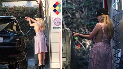 Addison Rae Flashes Sideboob in Candy Striper Dress at Car。